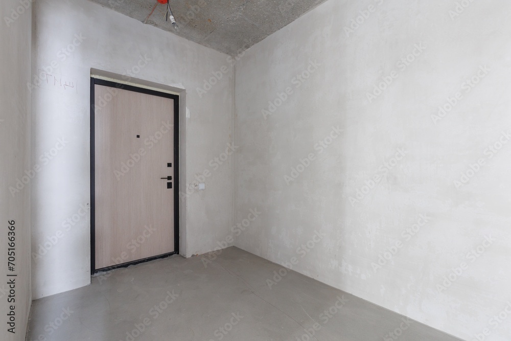 interior of the apartment without decoration in gray colors. rough finish interior of the apartment without decoration in gray colors. rough finish