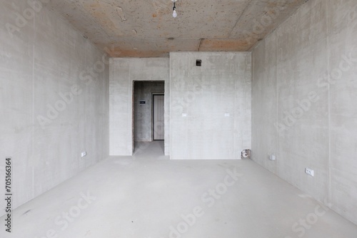 interior of the apartment without decoration in gray colors. rough finish