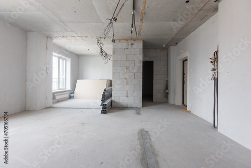 interior of the apartment without decoration in gray colors. rough finish