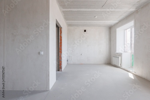 interior of the apartment without decoration in gray colors. rough finish