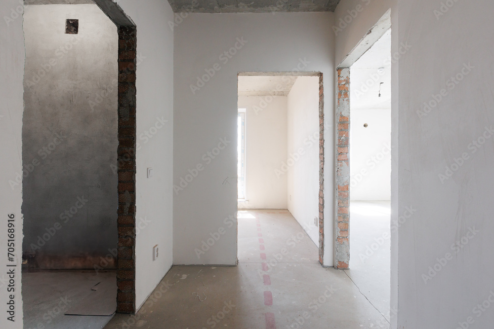 interior of the apartment without decoration in gray colors. rough finish interior of the apartment without decoration in gray colors. rough finish