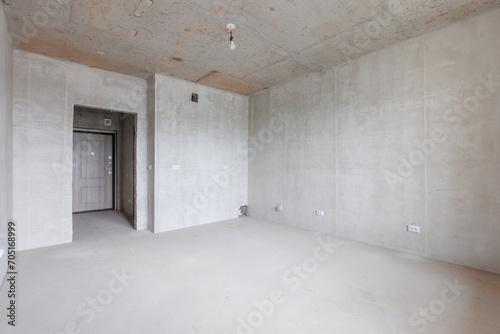 interior of the apartment without decoration in gray colors. rough finish