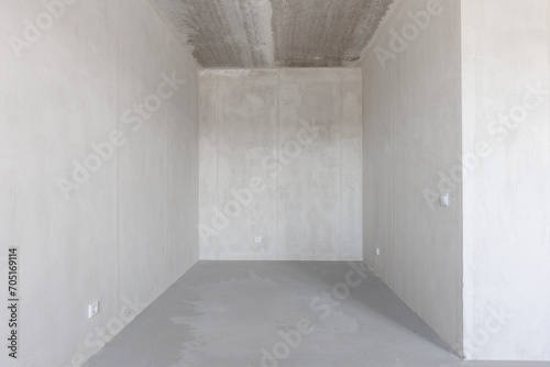 interior of the apartment without decoration in gray colors. rough finish