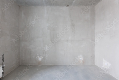 interior of the apartment without decoration in gray colors. rough finish © gluschenkoart