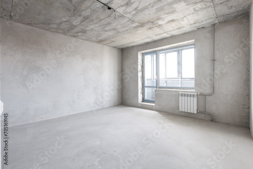 interior of the apartment without decoration in gray colors. rough finish