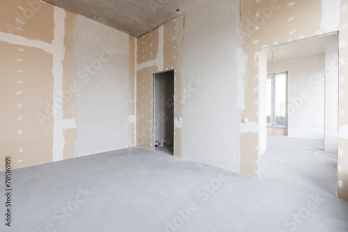 interior of the apartment without decoration in gray colors. rough finish