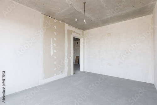 interior of the apartment without decoration in gray colors. rough finish