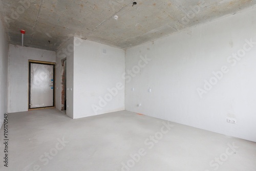interior of the apartment without decoration in gray colors. rough finish