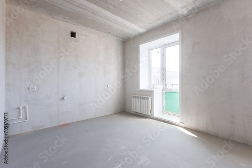 interior of the apartment without decoration in gray colors. rough finish