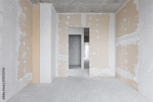 interior of the apartment without decoration in gray colors. rough finish