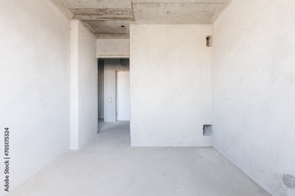 interior of the apartment without decoration in gray colors. rough finish