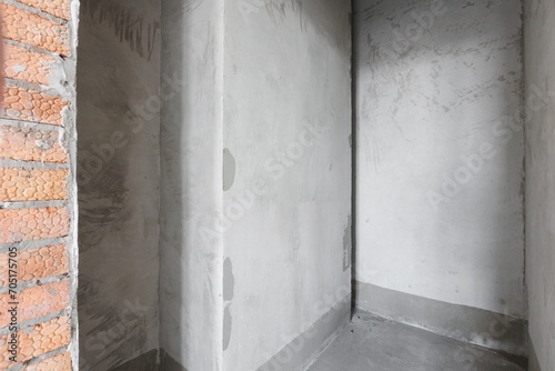 interior of the apartment without decoration in gray colors. rough finish