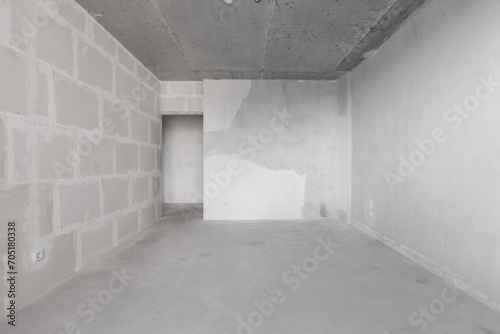 interior of the apartment without decoration in gray colors. rough finish © gluschenkoart