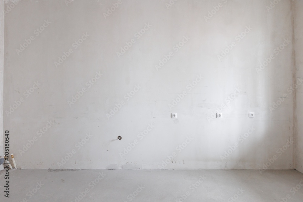 Fototapeta premium interior of the apartment without decoration in gray colors. rough finish