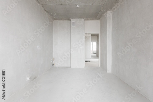 interior of the apartment without decoration in gray colors. rough finish