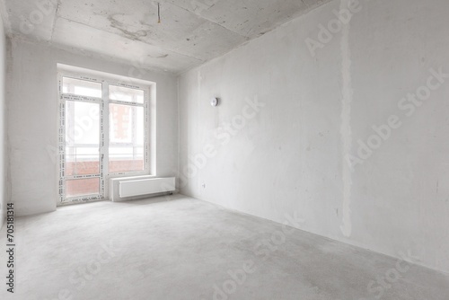 interior of the apartment without decoration in gray colors. rough finish