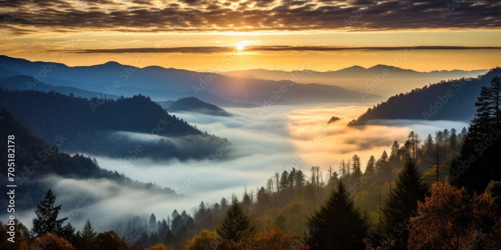 Mountain landscape with forested hills with fog in the valley at sunrise. Breathtaking natural scenery