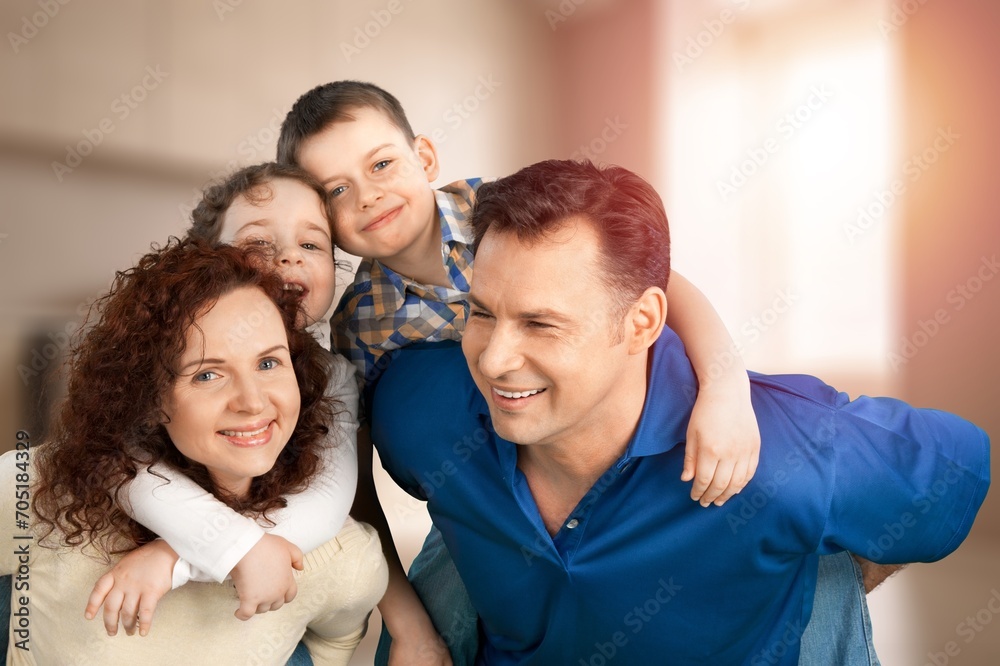 Fototapeta premium Mom, dad and small child have fun at home