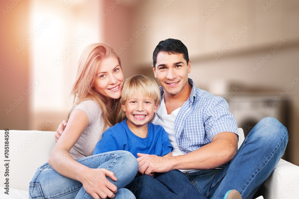 Mom, dad and small child have fun at home