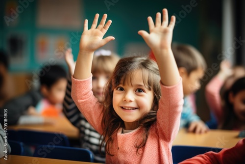 Young girl raising hand in elementary school classroom