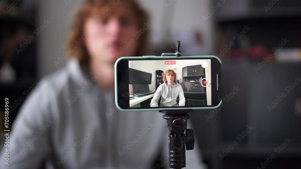 blogger records himself on his phone