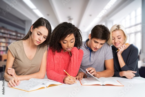 Confident group of college students sitting at classroom