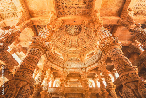 Bas-relief at columns at famous ancient Ranakpur Jain temple in Rajasthan state, India photo