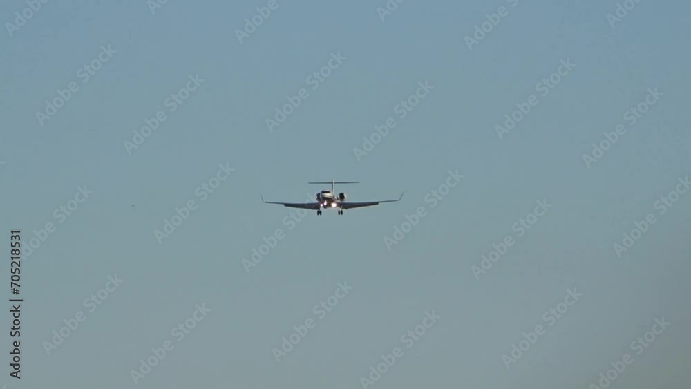 High end business jet head on front final approach into airport High end business jet head on front final approach into airport