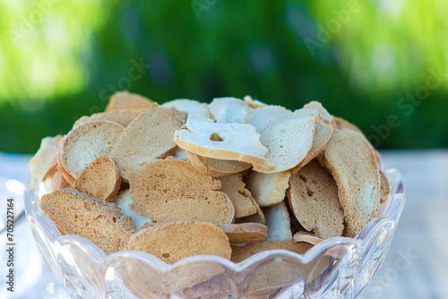 Toasted bread rolls in a glass bowlt photo