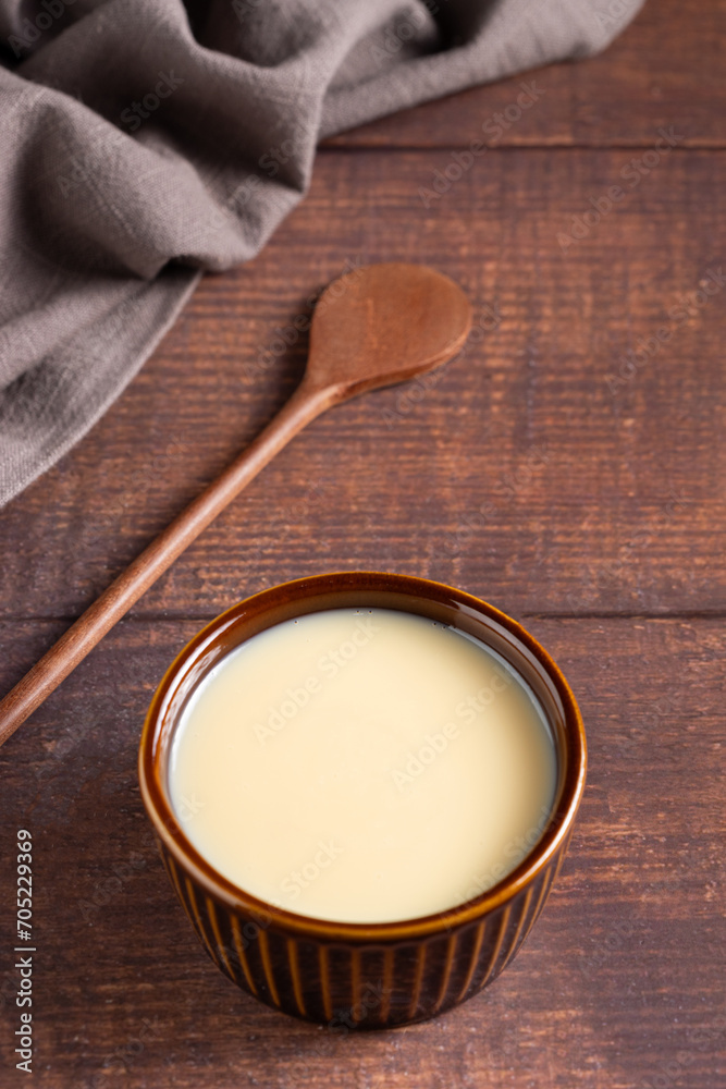 Fresh condensed milk in the bowl. Fresh condensed milk in the bowl.