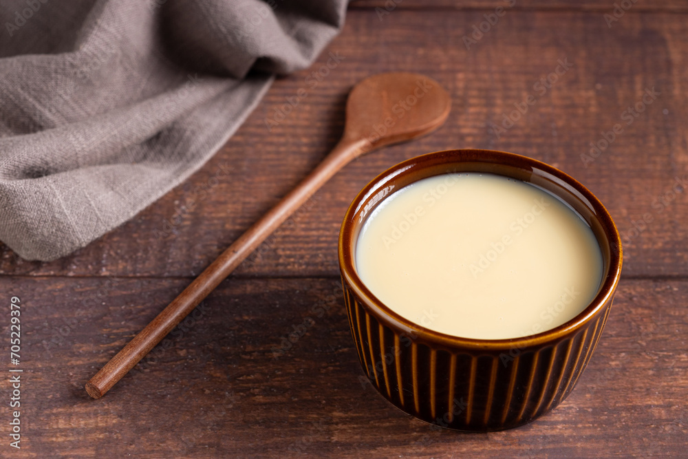 Fresh condensed milk in the bowl. Fresh condensed milk in the bowl.