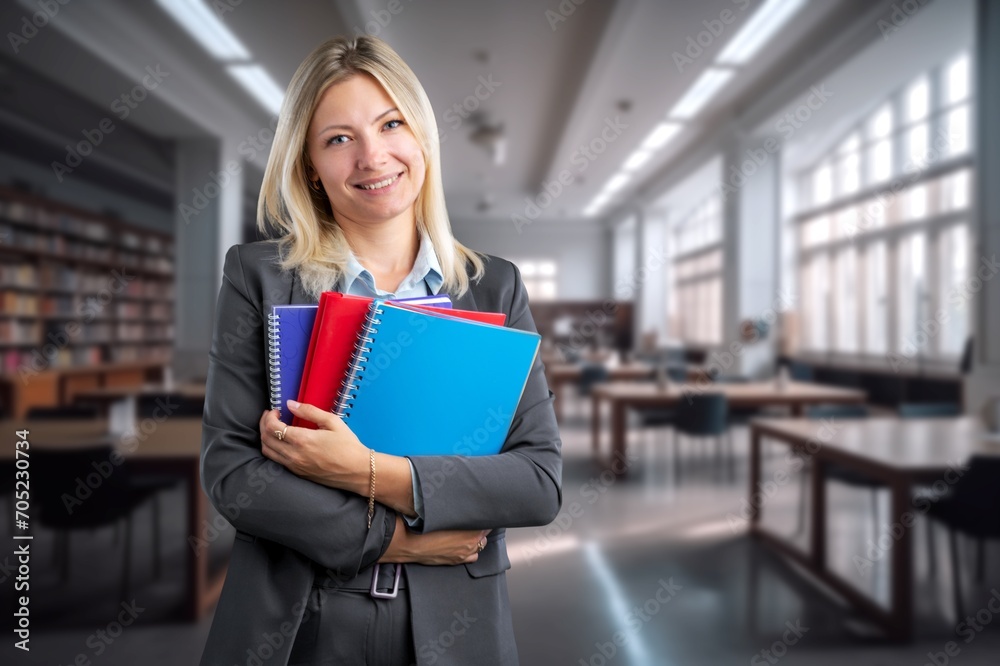 Happy school teacher at work in the classroom Happy school teacher at work in the classroom