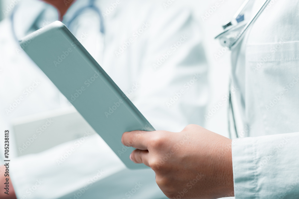Medical professional's hands hold tablet, symbolizing innovation Medical professional's hands hold tablet, symbolizing innovation