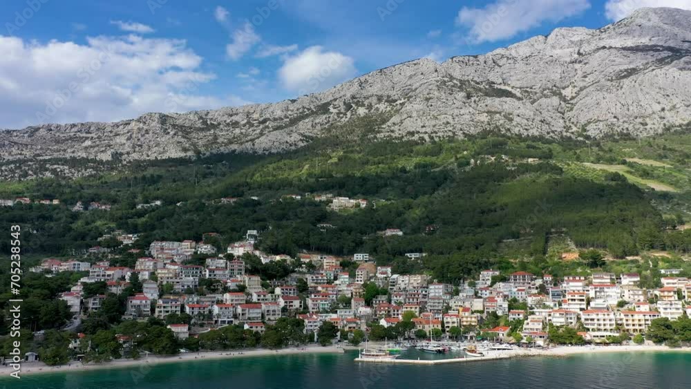 Beautiful Brela on Makarska riviera, Croatia. Adriatic Sea with amazing turquoise clean water and white sand. Aerial view of Brela beach and waterfront on Makarska riviera, Dalmatia region of Croatia. Beautiful Brela on Makarska riviera, Croatia. Adriatic Sea with amazing turquoise clean water and white sand. Aerial view of Brela beach and waterfront on Makarska riviera, Dalmatia region of Croatia.