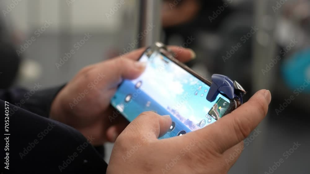 playing video game on mobile phone