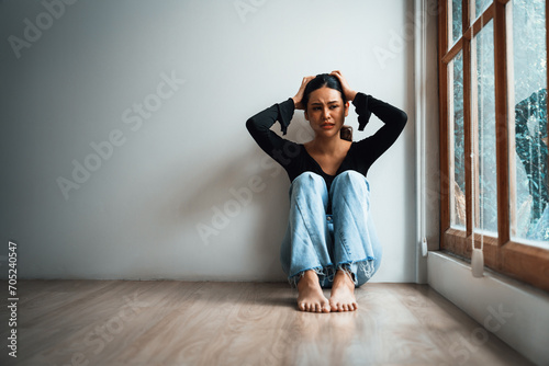 Depressed young Asian woman with mental health problem in mind need uttermost treatment from overthinking fatigue, disruptive thought, dissocial, anxiety and other mental health disorders . photo