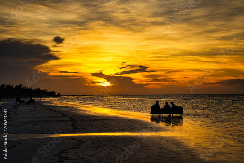 Watching the sunset on the beach © Zsuzsanna