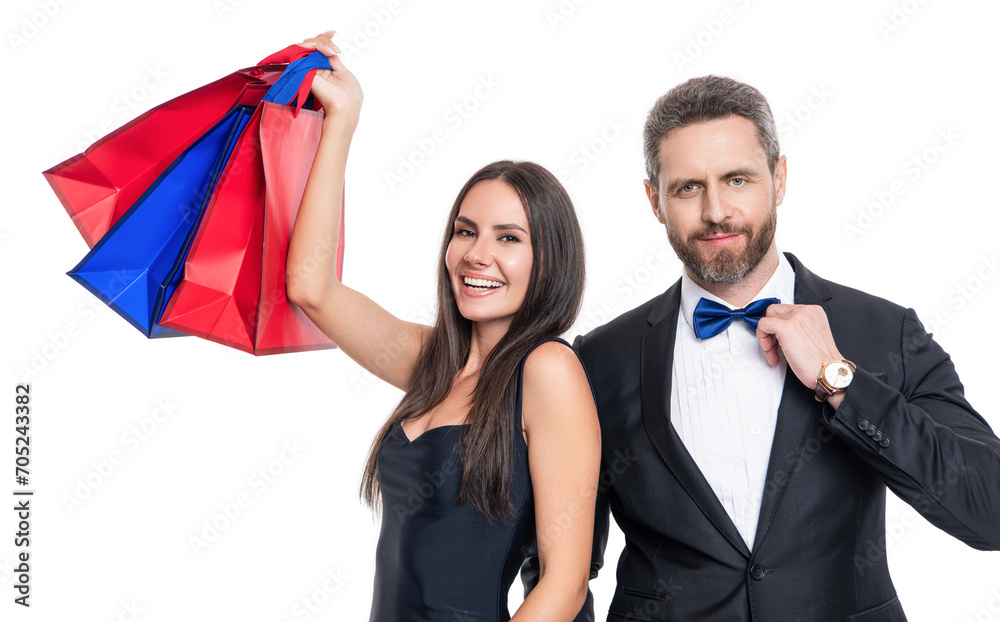 Couple holding shopping bags isolated white. Couple with shopper bags in mall. Consumerist duo. Purchasing present together. Two man and woman in shop mall. Big sale and shopping with couple Couple holding shopping bags isolated white. Couple with shopper bags in mall. Consumerist duo. Purchasing present together. Two man and woman in shop mall. Big sale and shopping with couple