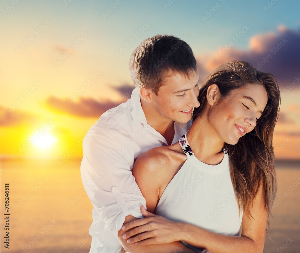 Young diverse couple have fun together at the beach