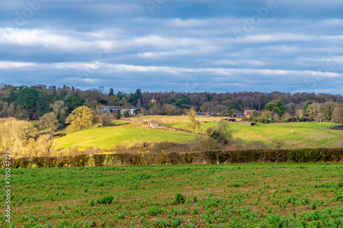 A view across the fields towards the village of Gumley in Leicestershire, UK on a bright winter day

