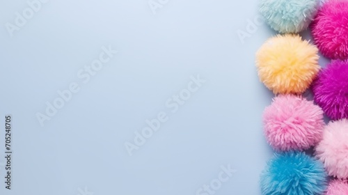 A set of colorful pom-poms with a high angle and copy space. photo