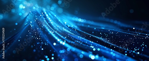  The image shows a swirl of blue lights on a black background. great image for a website or blog background 