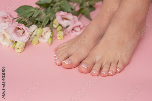 Perfectly done french manicure on woman feet.