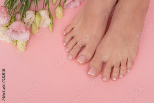 Perfectly done french manicure on woman feet.