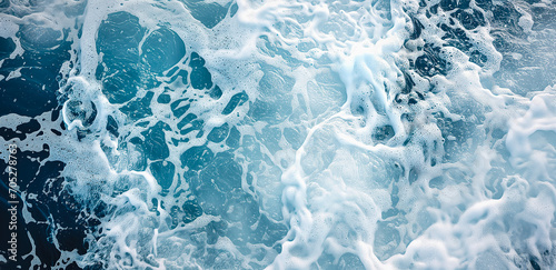 Fototapeta Naklejka Na Ścianę i Meble -  Blue ocean water texture background. Turquoise foamy surface of the sea with wave.
