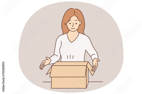 Smiling woman unpack box with order