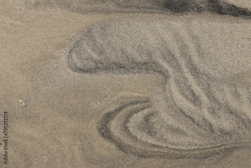 Natural pattern on the beach sand, black and white.