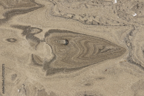 Natural pattern on the beach sand, black and white.