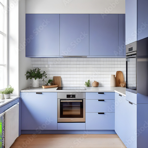 Beautiful bright calm kitchen interior detail with soft periwinkle cornflower blue cabinets with minimal modern furnishing 