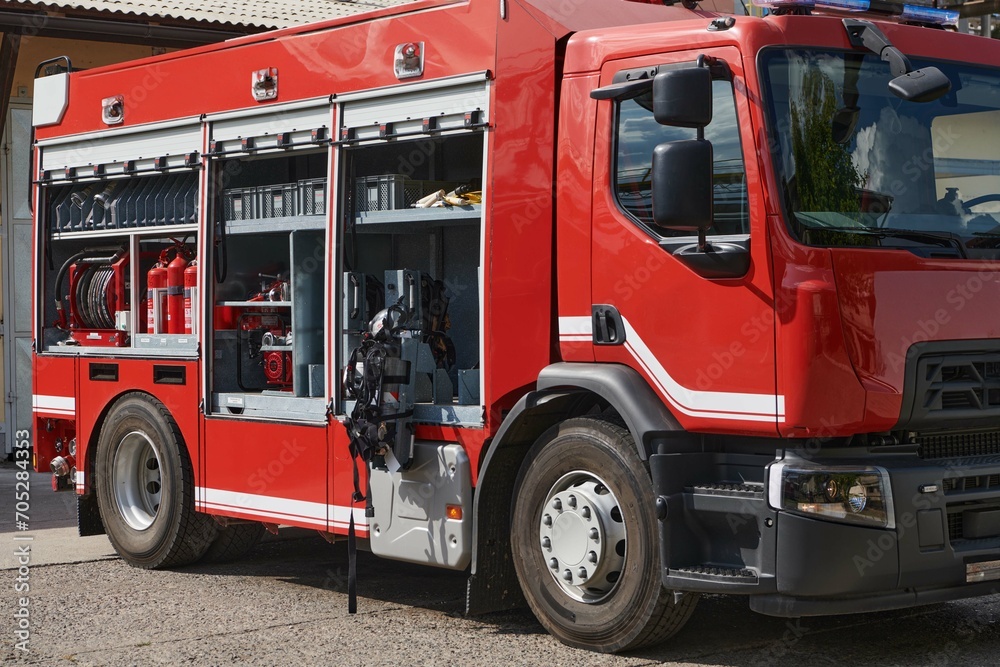 A state-of-the-art firetruck, equipped with advanced rescue technology, stands ready with its skilled firefighting team, prepared to intervene and respond rapidly to emergencies, ensuring the safety A state-of-the-art firetruck, equipped with advanced rescue technology, stands ready with its skilled firefighting team, prepared to intervene and respond rapidly to emergencies, ensuring the safety